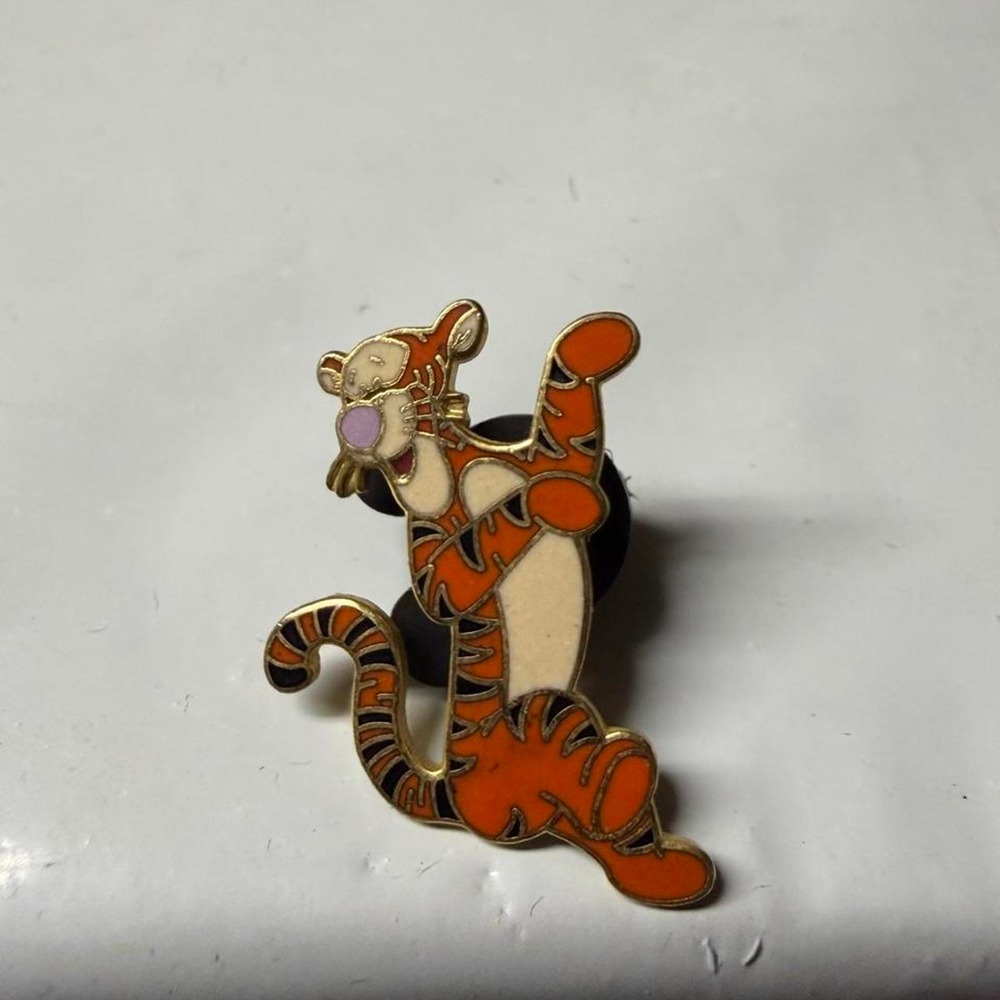 Disney Tigger pin with orange and black stripes'